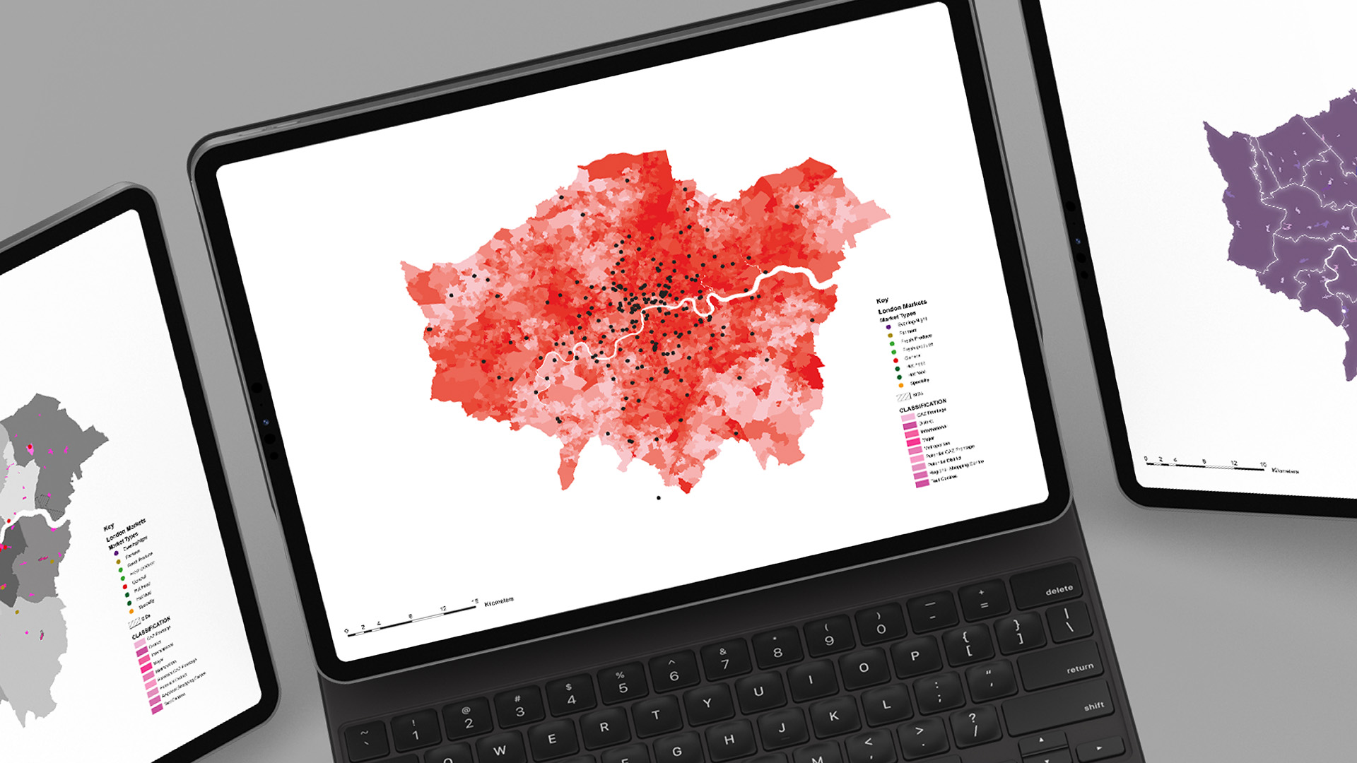 A close-up image of a laptop and tablets displaying the GLA Understanding London Markets Geodata Map animation graphic