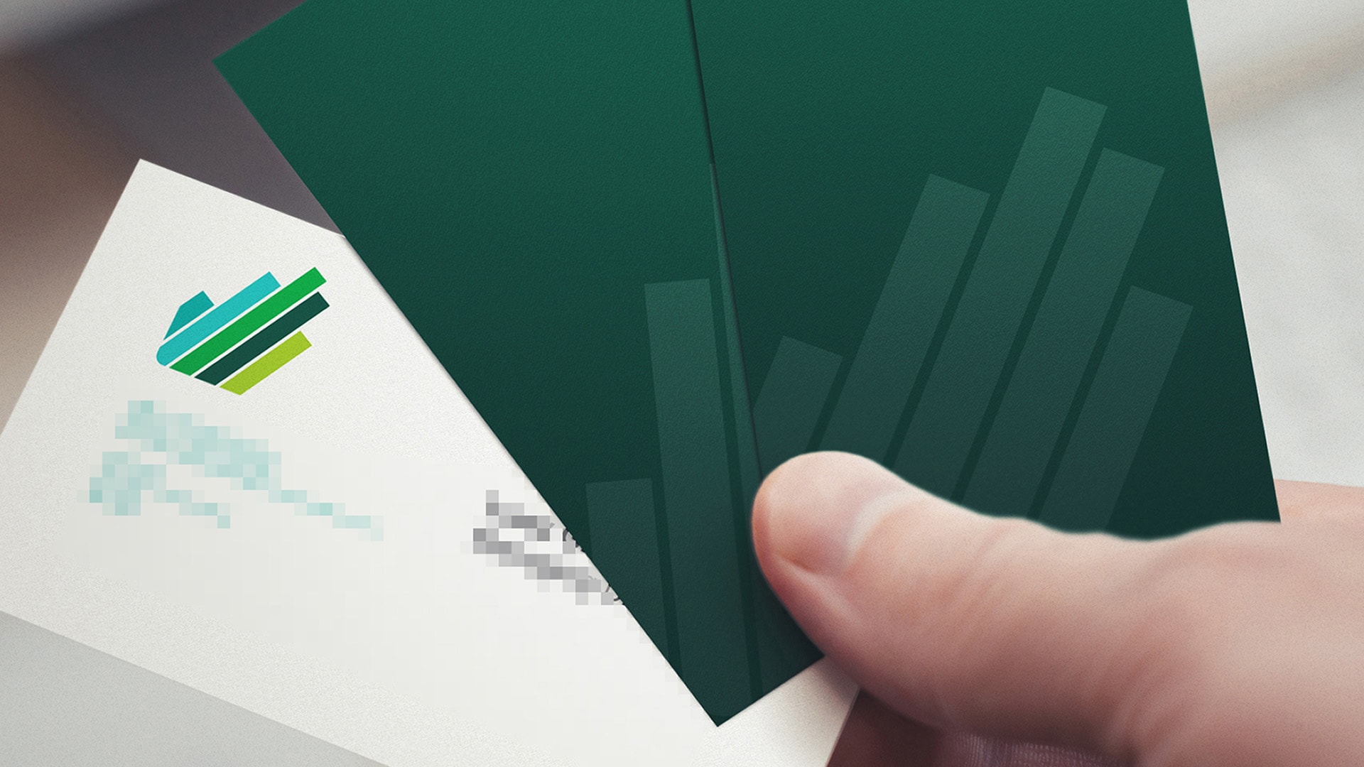 A close-up of two Greenfields Communications Business Cards