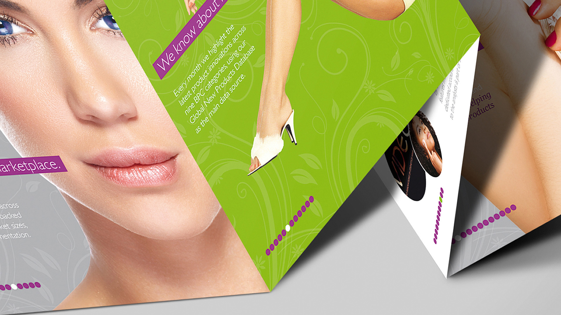 A close-up photograph of a Mintel Beauty Market Brochure on a smooth grey surface