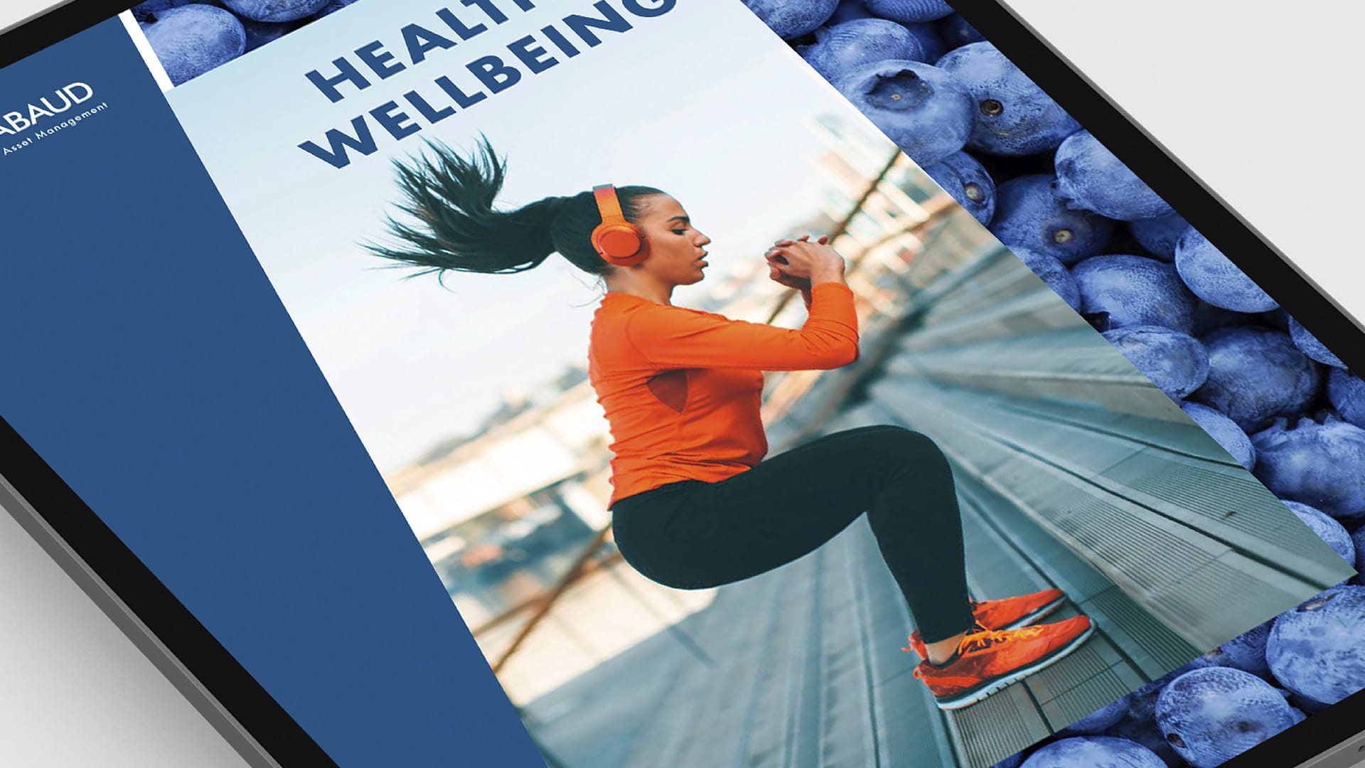 A close-up section of a tablet displaying a Mirabaud Global Themes Report Health and Wellbeing report cover.