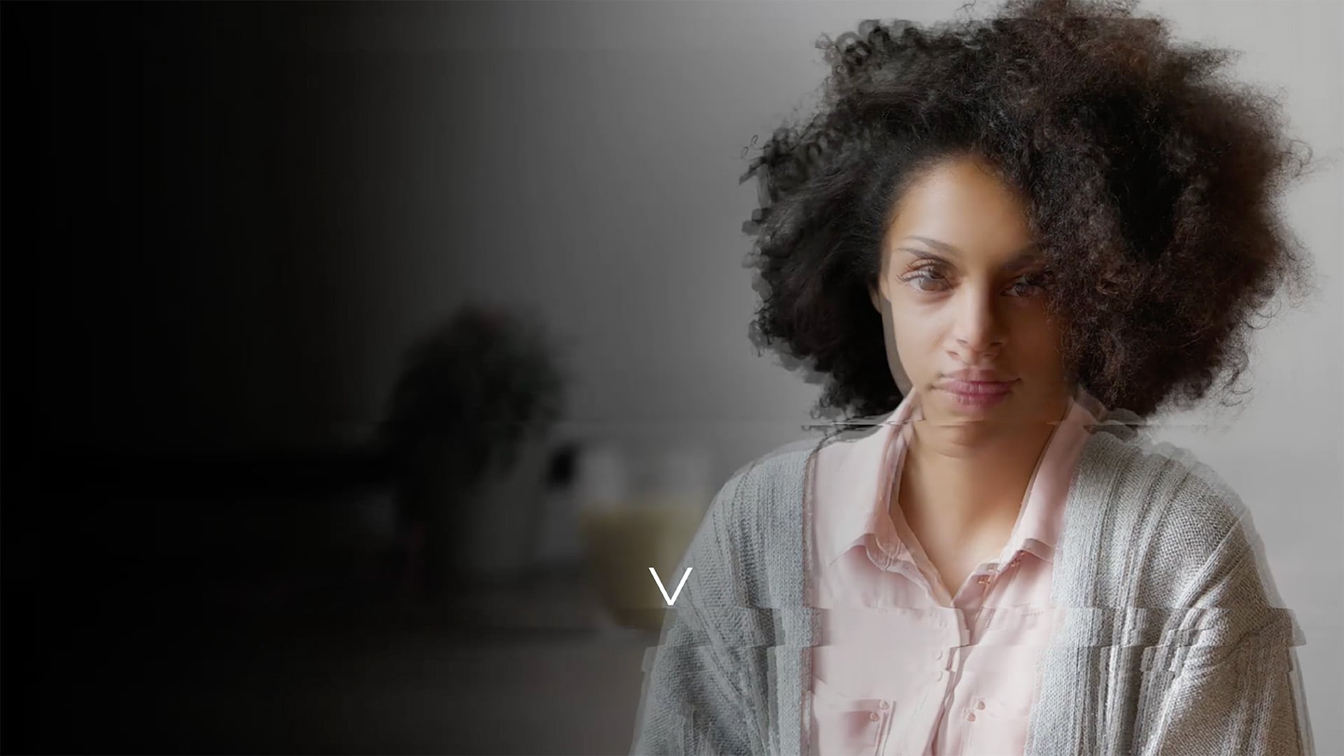 Real Leadership Consultancy RLC Video Transition Effect showing a distorted image of a woman with curly hair