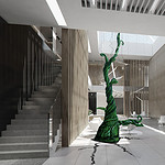 An image of a beanstalk growing through the floor of a corporate looking office