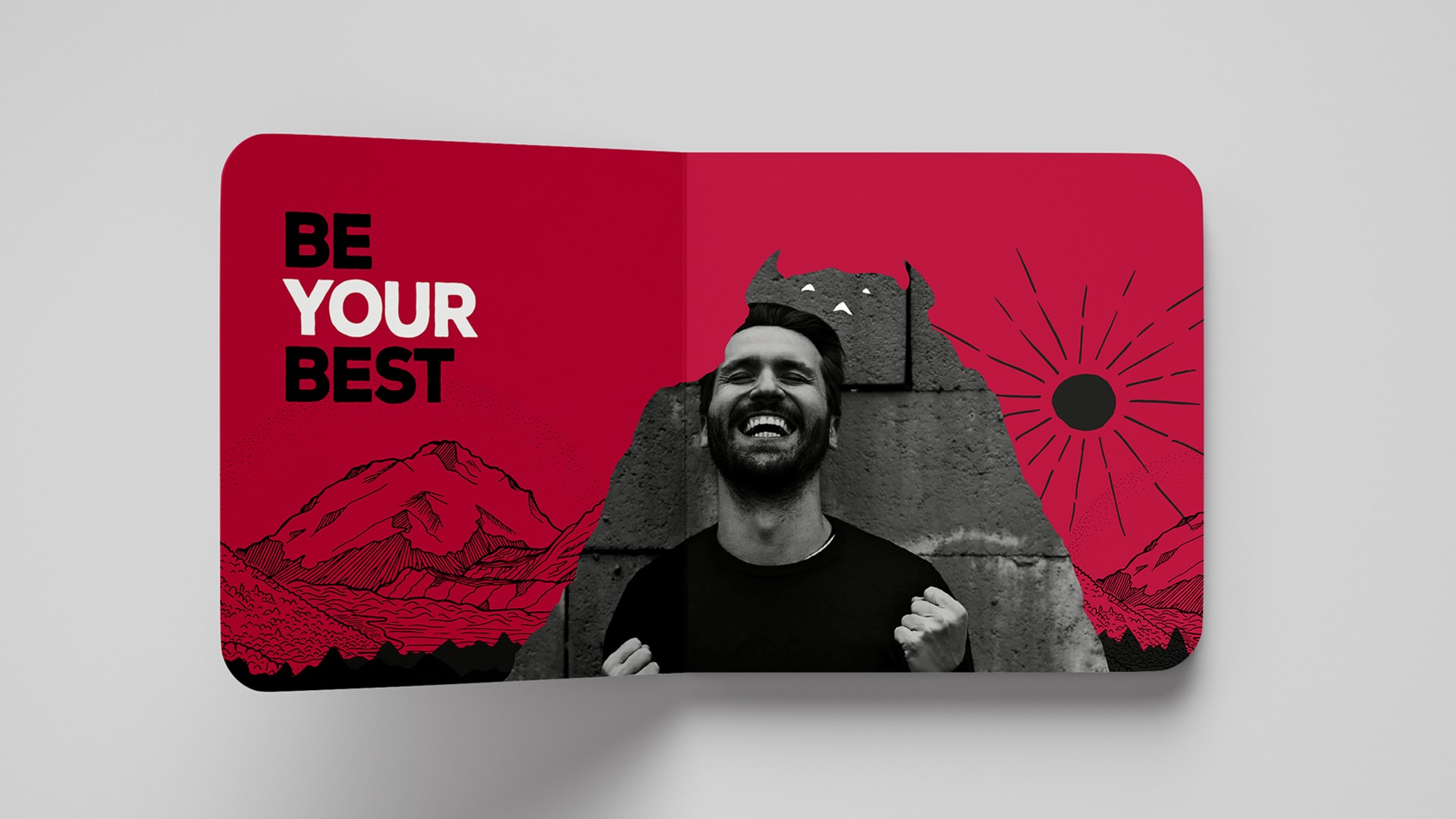 An image of an inside book cover design displaying the Beast branding consisting of and illustration of beast like creature that looks like a black mountain. Overlaying the beast is the photo of a man who looks as though he is celebrating an achievement. The words 'Be your best' are displayed